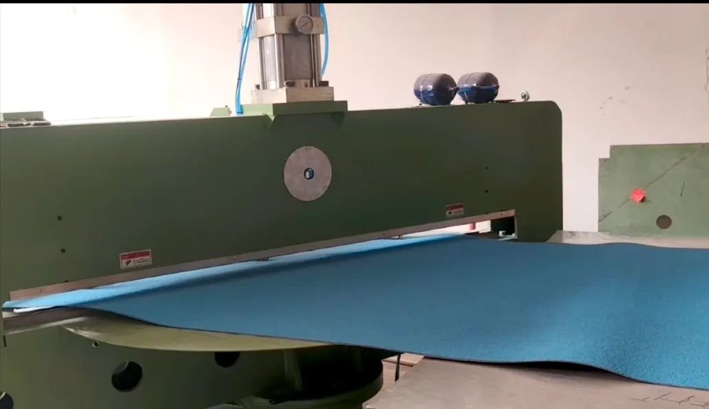 Coated abrasive material passing through converting equipment
